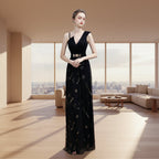 Black evening gown with star patterns on a white background
