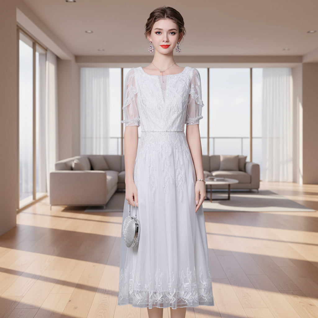 Woman wearing a white lace dress against a gray background