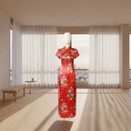 Red traditional garment with floral patterns on a plain background