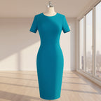 Teal dress on a mannequin against a white background
